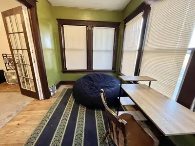 a room with a table and a bean bag chair at Binghamton Hospitals Private Room Shared Spaces Trades Medical Staff Welcom in Binghamton