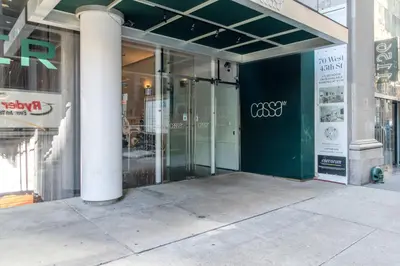 a store front with glass doors on a building at Blueground Midtown South rooftop nr Bryant Park NYC-2031 in New York