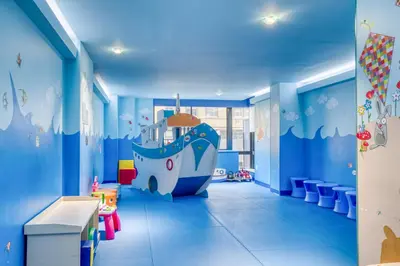 a childrens room with a large blue room with a large boat mural at Blueground Upper West Side fitness nr Central Park NYC-1993 in New York