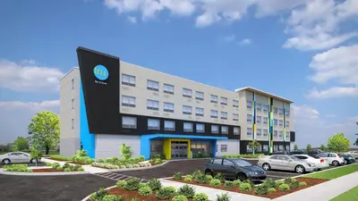 a rendering of a building with cars parked outside at Tru By Hilton Burlington, Nj in Burlington