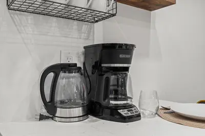 a coffeemaker sitting on a counter next to at Stylish 1BR Apartment Near Center City & University City in Philadelphia