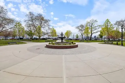 a fountain in the middle of a park at New and Beautiful 2BR Apt in Prime Spot 20 Min to NYC in Jersey City