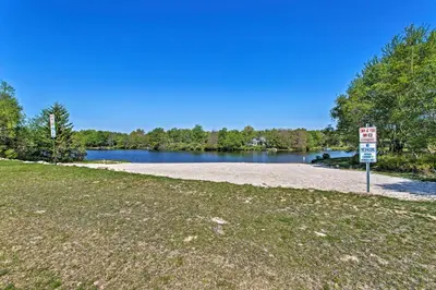 a no parking sign in front of a lake at Vibrant Hideaway on Shores of West Emerald Lake! in Long Pond