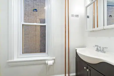 a bathroom with a sink and a window at Moonbeam Suite-Private Room in Serenity Manor in Chester