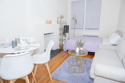 a living room with a couch and a table at Chic12 East Village Apartment Near Union Square Top Dining n Shopping in New York