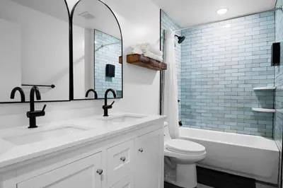 a bathroom with a sink and a toilet and a tub at Modern Mountain Escape Sleeps Large Groups in Pocono Summit