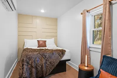 a bedroom with a bed and a window at Pocono Summit Lodge Game Room & Family Fun in Pocono Summit