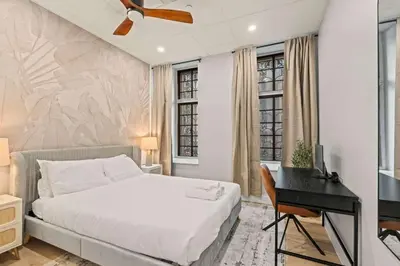 a bedroom with a bed and a desk at Apartmint at The Metropolitan1 - Philadelphia in Philadelphia