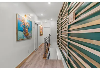 a hallway with a wooden wall with a painting on it at Philadelphia Rocky steps GSN Harvest 2 in Philadelphia