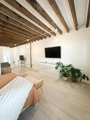 a bedroom with a bed and a flat screen tv at Retreat with Parking Sleeps 6 in Phoenixville
