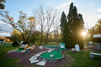 a miniature golf course with a putting green at Spring Gulch Lakefront Park Model 5 in Mount Airy