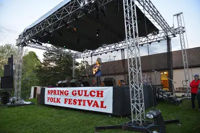 a person standing on a stage at a music festival at Spring Gulch Screened Park Model 7 in Mount Airy