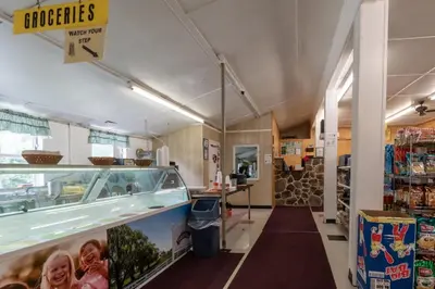 a grocery store aisle with a food counter in a store at Spring Gulch Country House 9 in Mount Airy