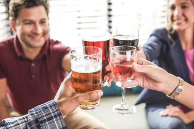 a group of people holding glasses of beer at Staybridge Suites-Philadelphia/Mount Laurel by IHG in Mount Laurel