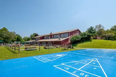 a basketball court in front of a building at Hershey Camping Resort Loft Park Model 7 in Mount Wilson