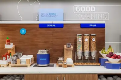 a kitchen with a counter with food on it at Holiday Inn Express Voorhees/ Mt. Laurel by IHG in Voorhees