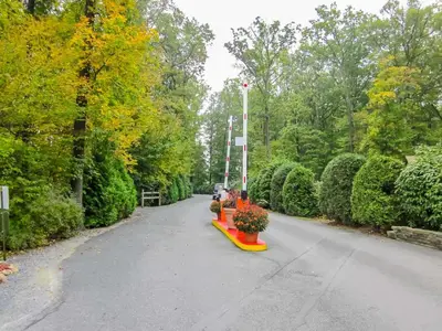 a park with a row of benches and trees at Appalachian Camping Resort Cottage 1 in Shartlesville
