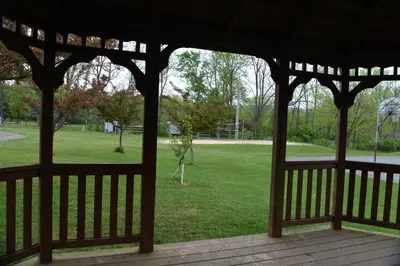 a gazebo with a view of a park at Appalachian Camping Resort Log Home 6 in Shartlesville