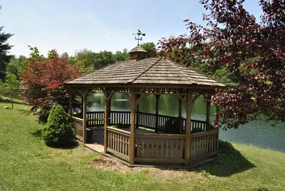 a gazebo with a cross on top in a park at Robin Hill Camping Resort Premium Cottage 1 in Lenhartsville