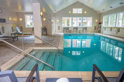 a large swimming pool in a hotel room at Residence Inn by Marriott Woodbridge Edison/Raritan Center in Woodbridge