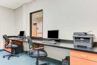 an office with a desk with a computer and chairs at Wingate by Wyndham - York in York