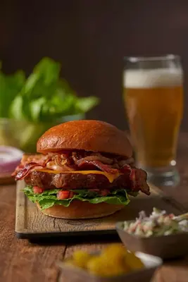a sandwich on a table with a glass of beer at Hyatt Place New York/Midtown-South in New York