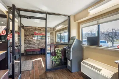 an empty restaurant with a cash register and a window at Red Roof Inn Danville, PA in Danville