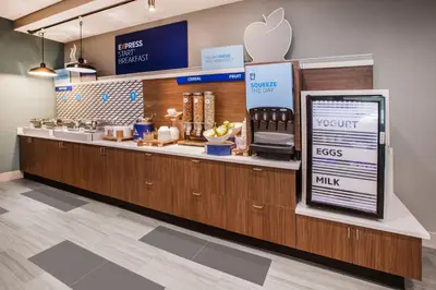 an apple store with a counter with an appleasteryasteryasteryasteryasteryasteryastery at Holiday Inn Express & Suites Carlisle - Harrisburg Area by IHG in Carlisle
