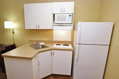 a kitchen with a white refrigerator and a sink at Extended Stay America Suites - Philadelphia - Mt Laurel - Crawford Place in Mount Laurel