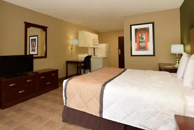a hotel room with a bed and a television at Extended Stay America Suites - Philadelphia - Cherry Hill in Maple Shade
