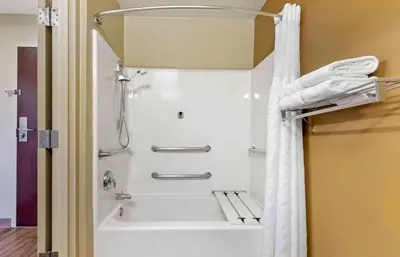 a shower in a bathroom with a white shower curtain at Extended Stay America Suites - Piscataway - Rutgers University in Randolphville