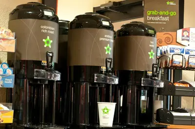 a group of bottles of coffee on a shelf at Extended Stay America Suites - Piscataway - Rutgers University in Randolphville