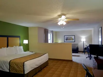 a hotel room with a bed and a ceiling fan at Extended Stay America Suites - Philadelphia - Plymouth Meeting - East in Plymouth Meeting