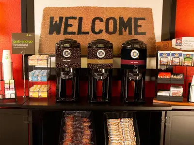 a store with a welcome sign on a counter at Extended Stay America Suites - Philadelphia - King of Prussia in King of Prussia