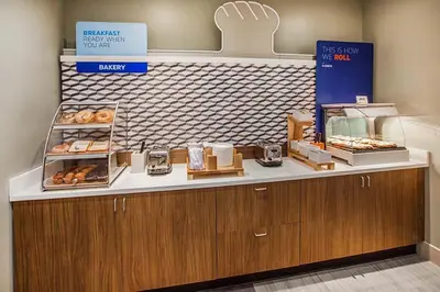 a bakery with a counter with donuts on it at Holiday Inn Express Selinsgrove by IHG in Shamokin Dam