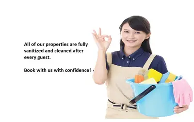 a woman in an apron holding a bucket at Beautiful Lux 4 Bedroom*Near PENN/CHOP*Roof Deck in Philadelphia
