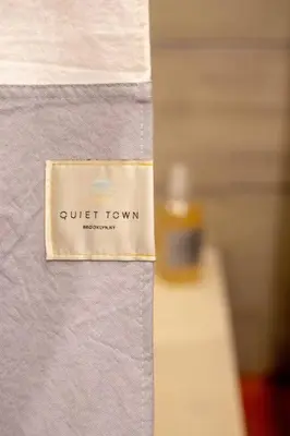 a sign that says quiet town on a wall at Poor Richard Studio at Kestrel Hotel in Philadelphia