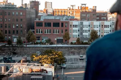 a view of a city with cars and buildings at Rail Park Studio at Kestrel Hotel in Philadelphia