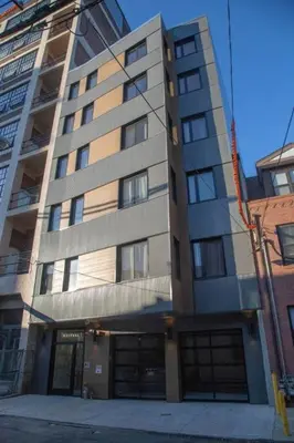 a tallartment building with two garage at Rail Park Studio at Kestrel Hotel in Philadelphia