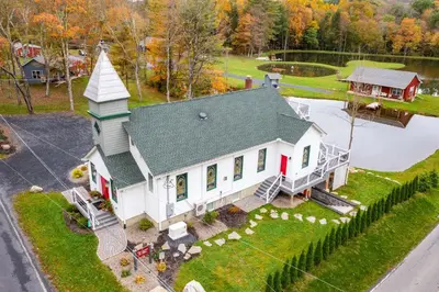 an aerial view of a house with a church at Unwind Fireside! Poconos Cottage 12 Mi to Slopes in Brodheadsville