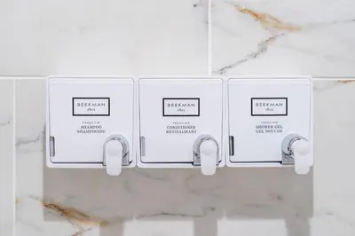 two electrical outlets on a white marble wall at Sosuite at West Lofts - West Philadelphia in Philadelphia