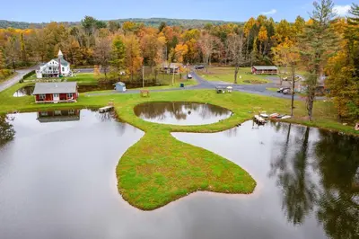 an island in the middle of a lake at 13 Mi to Camelback Ski! Creekside Lincoln Lodge in Brodheadsville