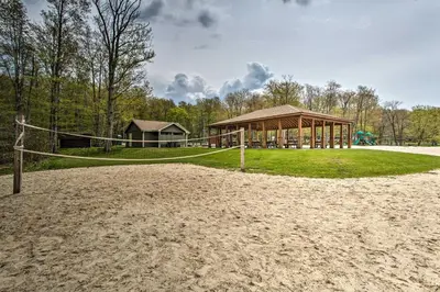 a volleyball court with a gazebo at Near Skiing Pocono Lake Cabin with Screened Patio in Pocono Lake
