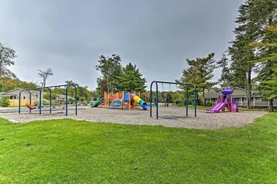 a park with a playground with slides at 1 Mi to Lake Family-Friendly Tobyhanna Home in Tobyhanna