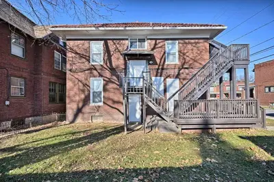 a house with a staircase in front of a building at Suites on Seneca - Lovely 2 Bed 1 Bath Apartment in Harrisburg