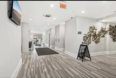 a hallway with a room with a sign in it at XL Studio - Studio with Pool & Scenic Rooftop in Philadelphia