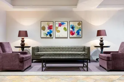 a living room with a couch and two chairs at Chelsea 1BR w Gym nr Penn Station MSG NYC-528 in New York