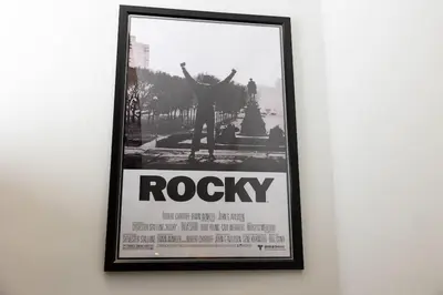 a framed poster of a person on a wall at Thena Hotel - Ground Floor 1 Bedroom Suite in Philadelphia