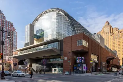 a large building with an arch on a city street at Thena Hotel - Oversized 1 Bedroom in Philadelphia