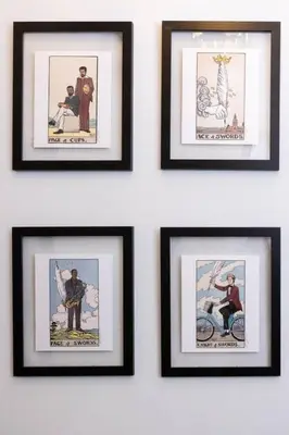 a group of framed pictures hanging on a wall at Thena Hotel - Cozy Studio in Philadelphia